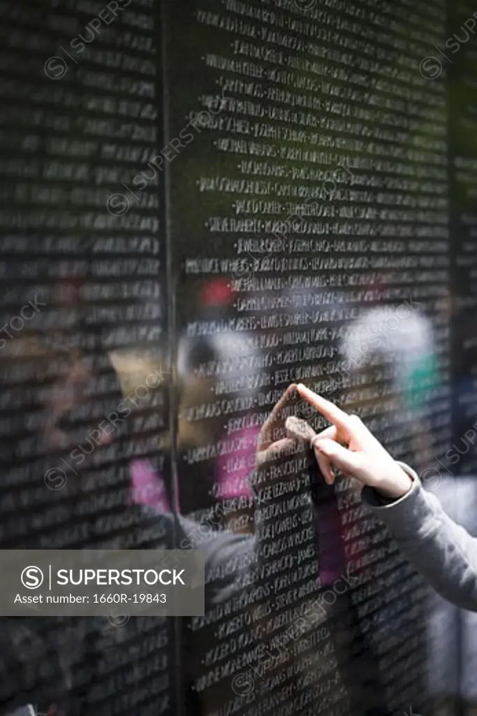 Vietnam Veterans Memorial with finger pointing