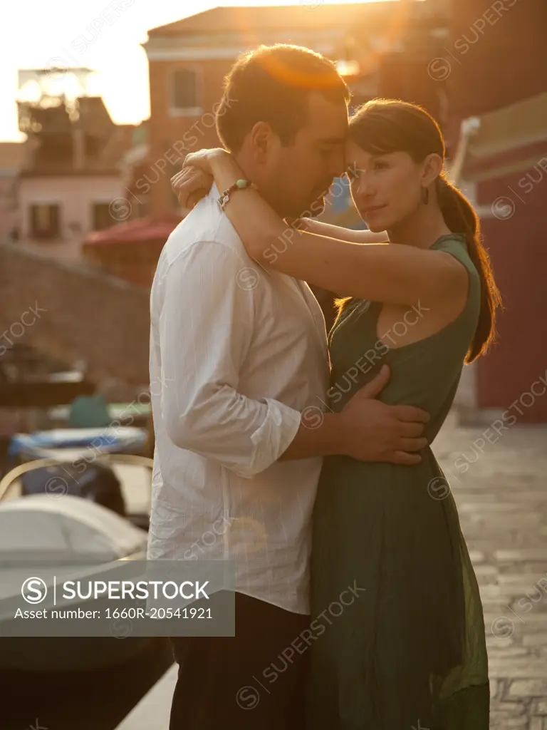 Italy, Venice, Mature couple embracing