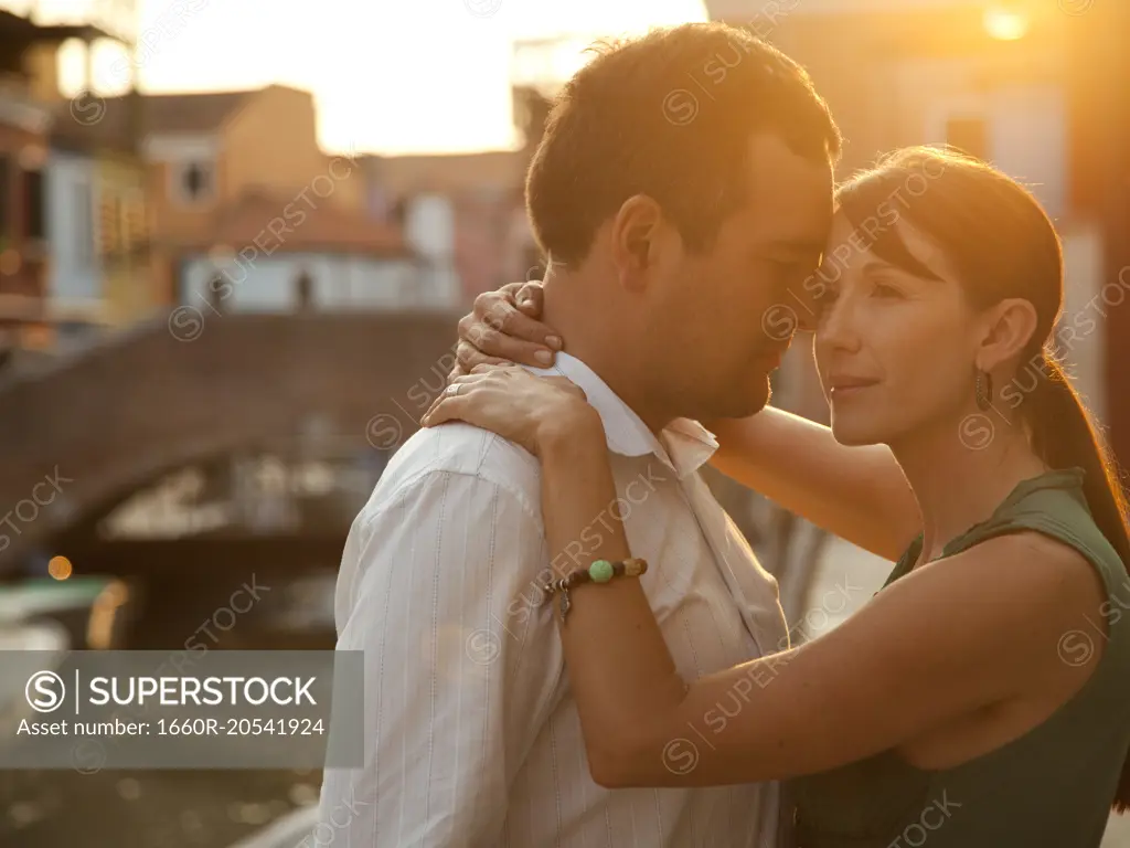 Italy, Venice, Mature couple embracing