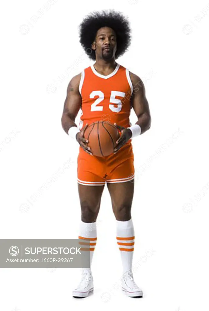 Basketball player with an afro in orange uniform