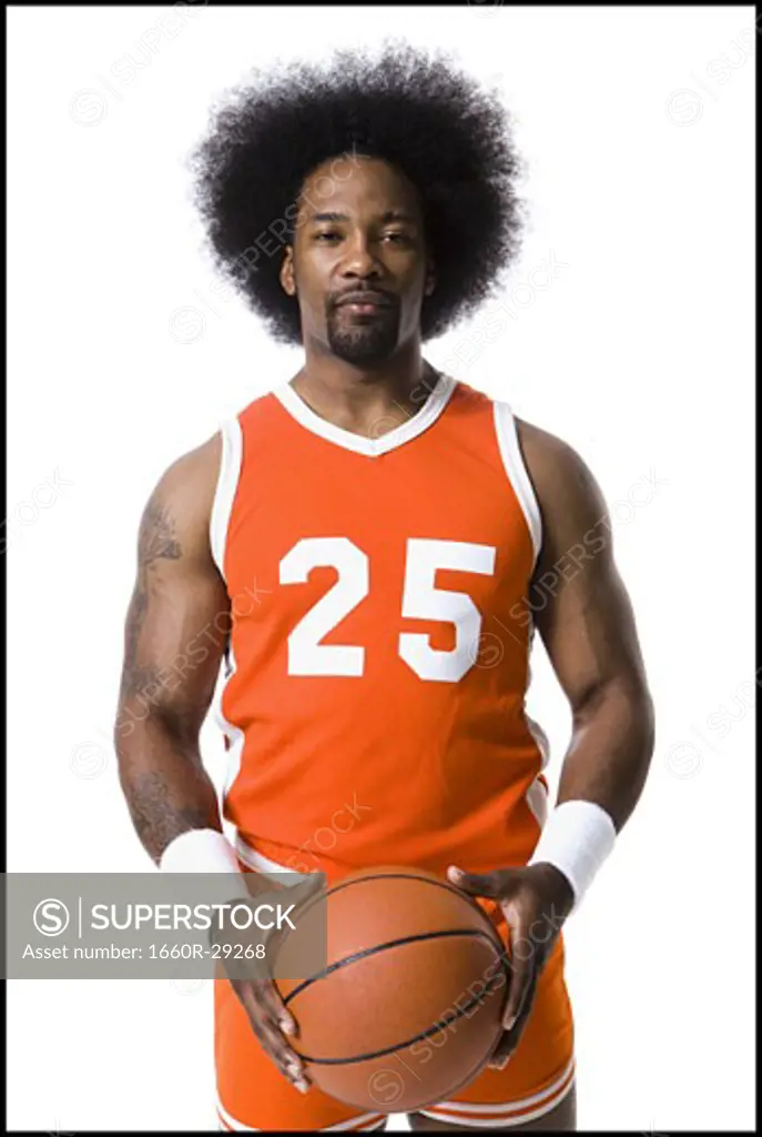 Basketball player with an afro in orange uniform