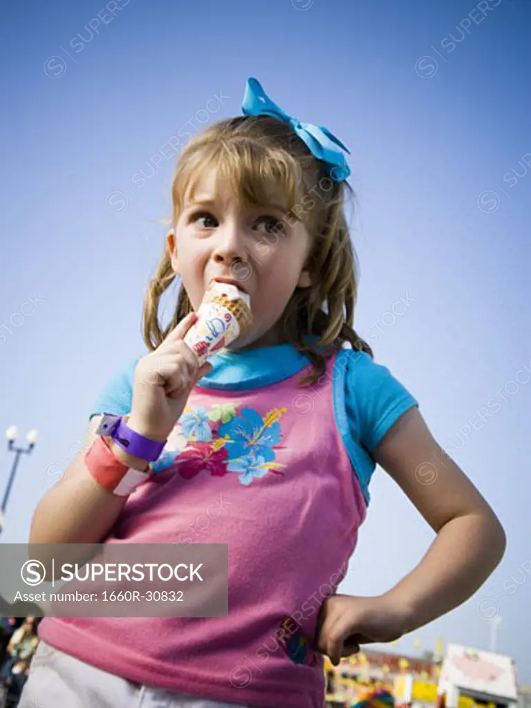 Young girl eating ice cream cone