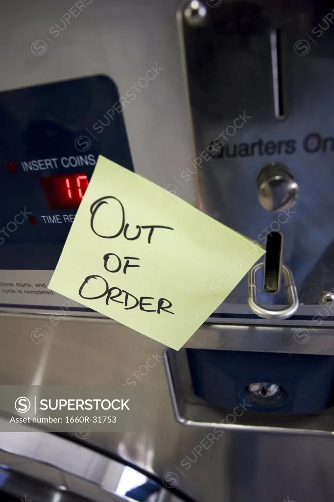 Out of order sign on Laundromat machine