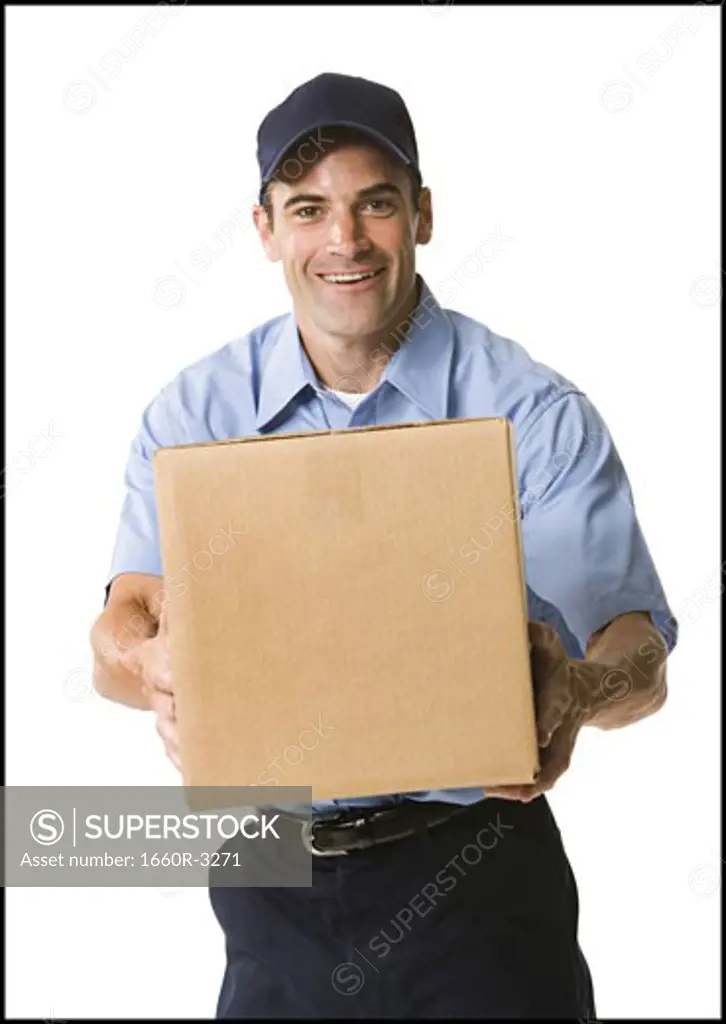 Portrait of a mailman holding a package