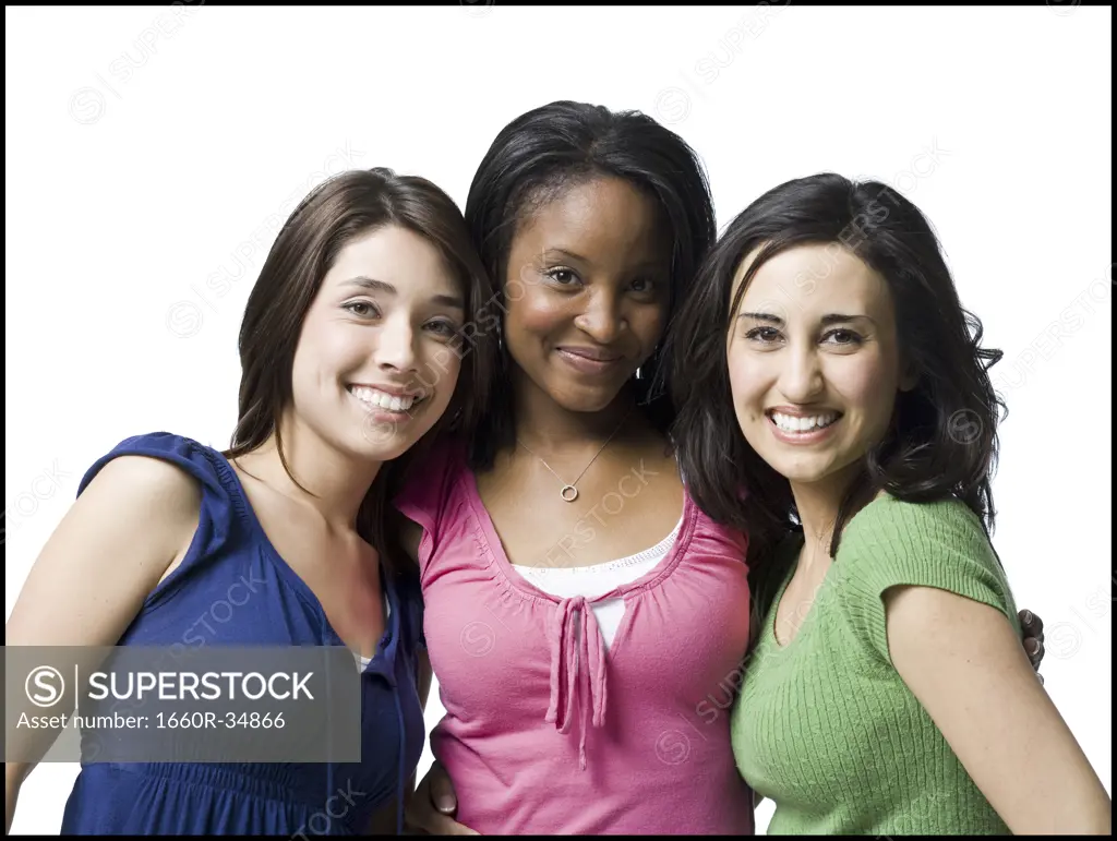 Three women hugging and smiling