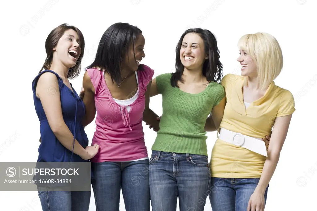 Four women hugging and smiling