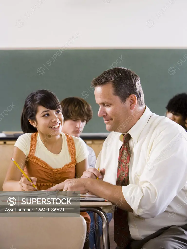 Student and teacher in a classroom.