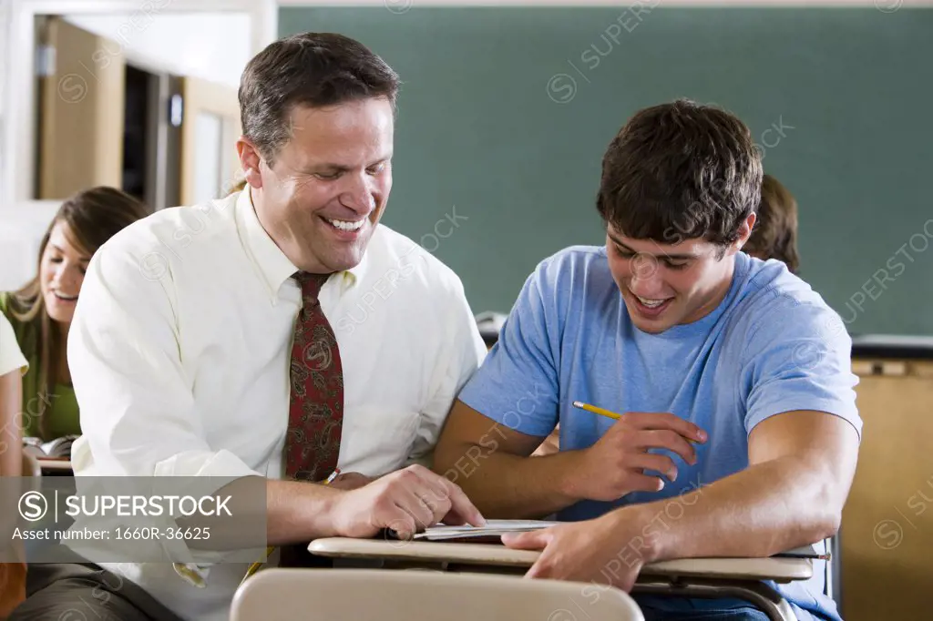 Student and teacher in a classroom.