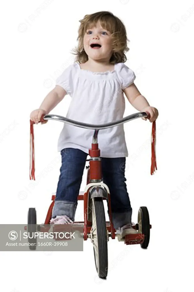 little girl on a tricycle