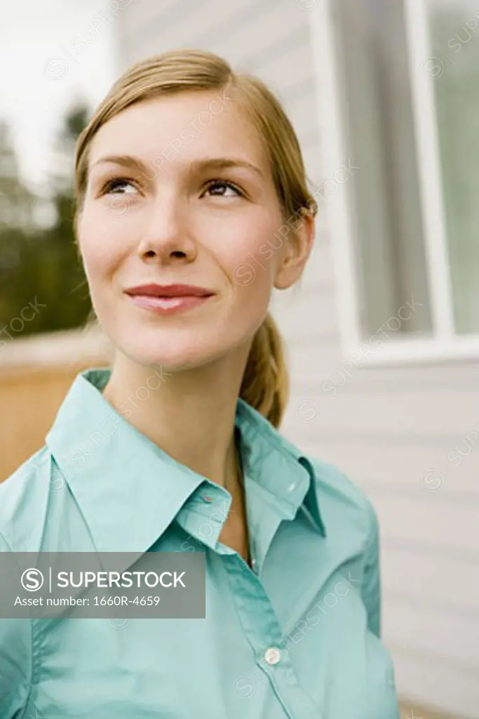 Close-up of a young woman looking up