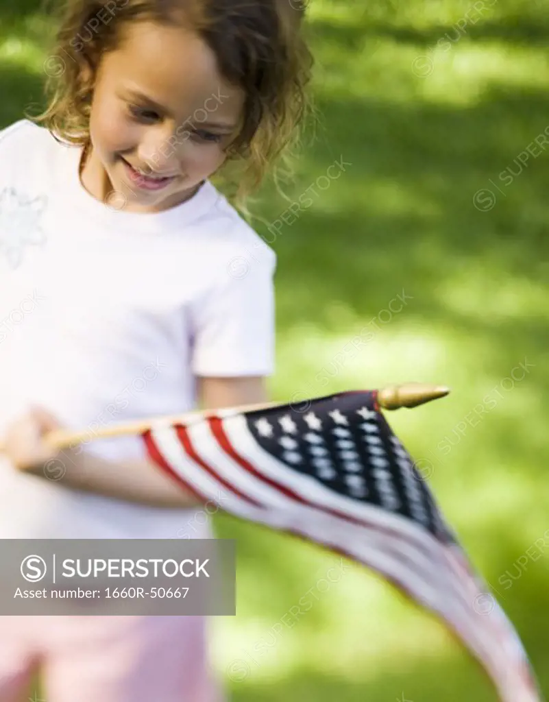 Girl holding US flag