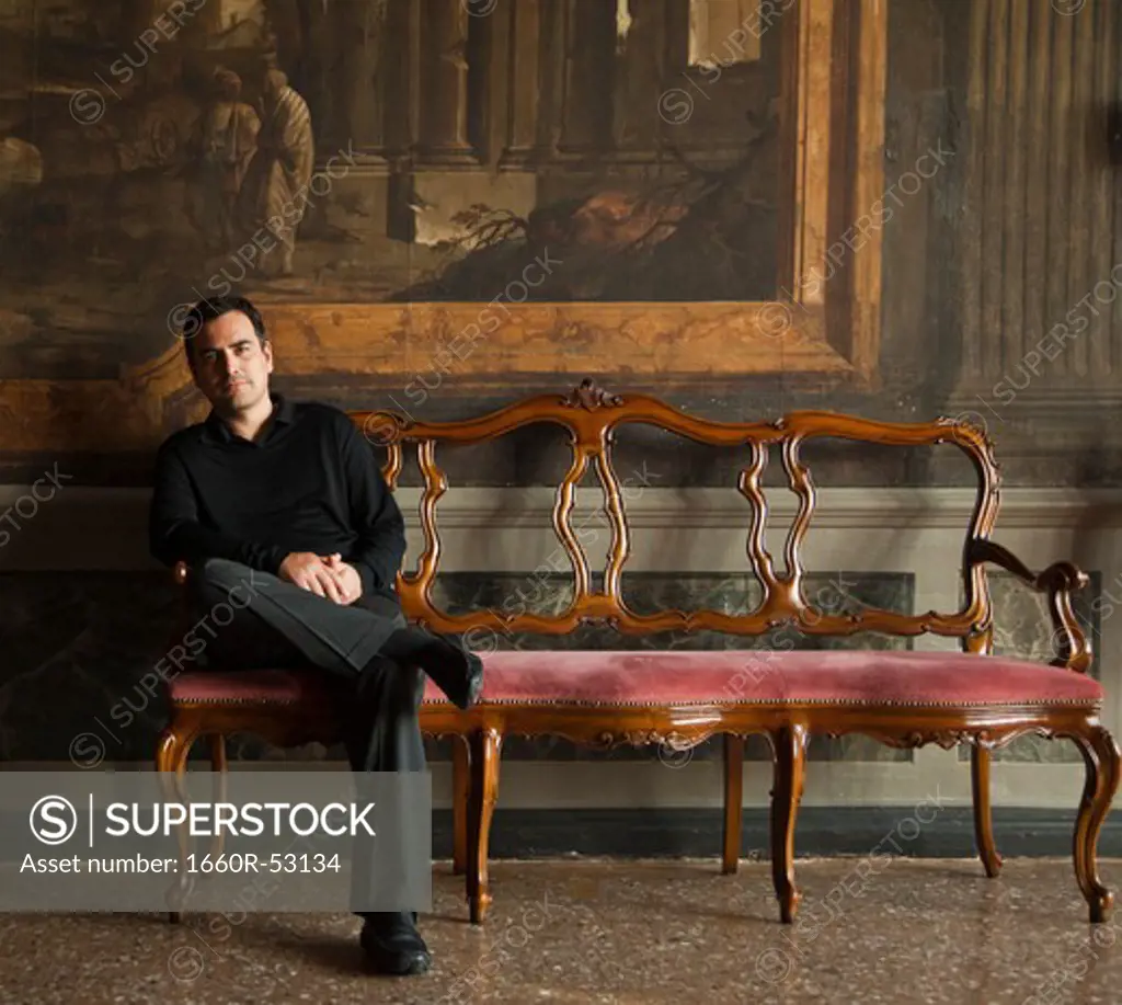 Italy, Venice, Mature man posing in museum hall