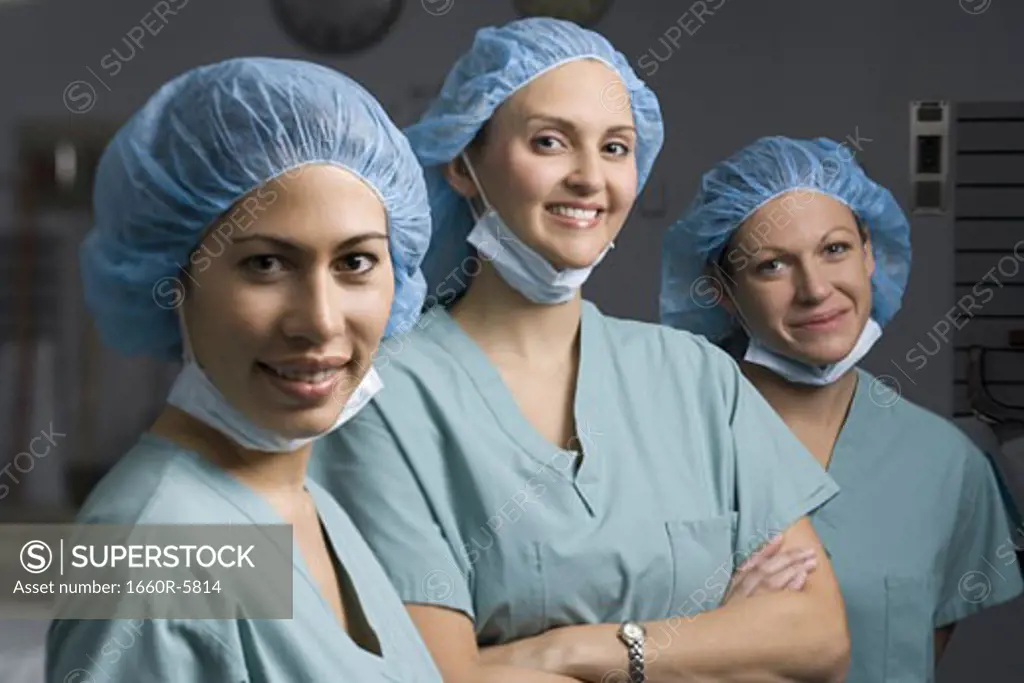 Portrait of three female surgeon smiling