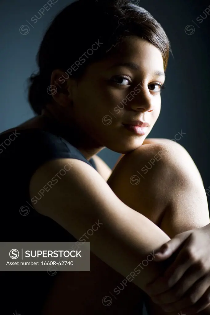 Woman resting chin on knee