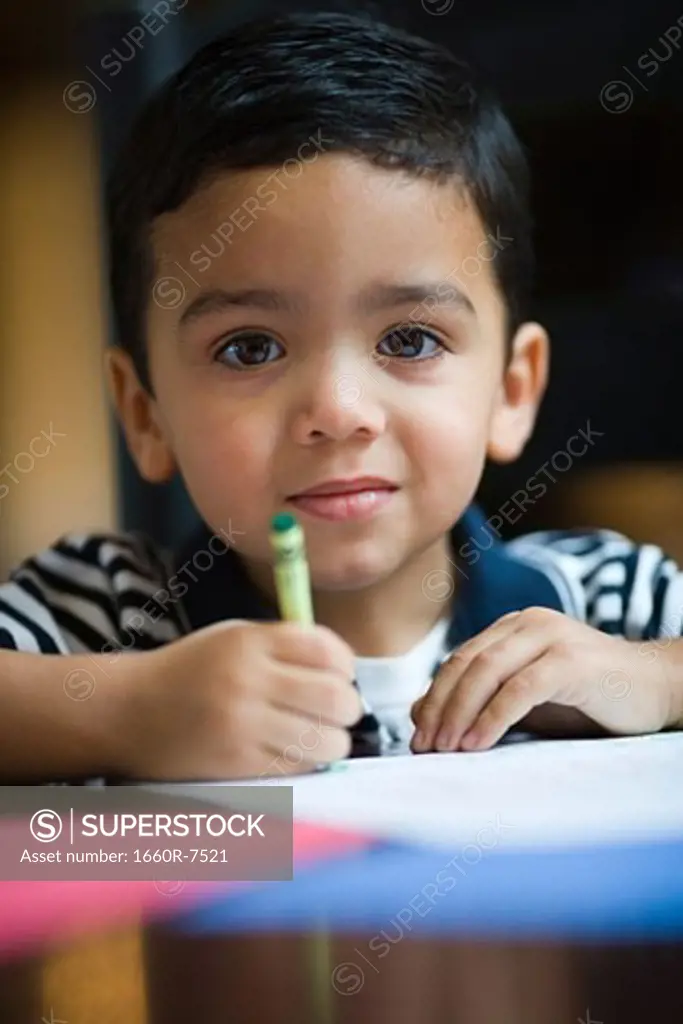 Portrait of a boy coloring