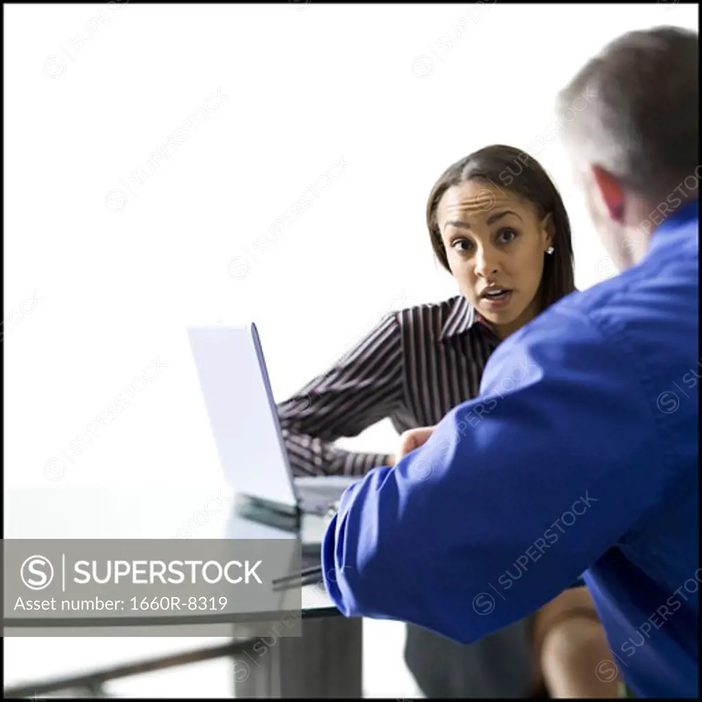 Close-up of a businesswoman and a businessman meeting