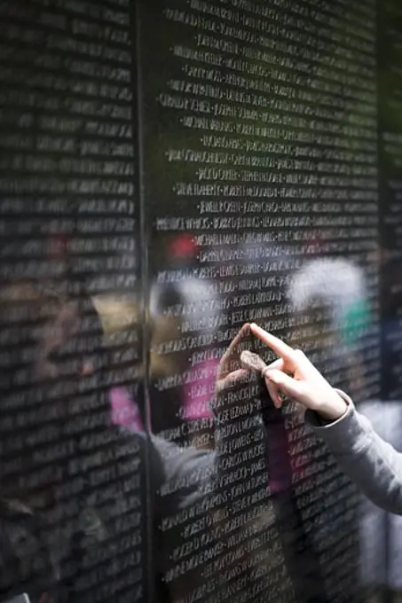 Vietnam Veterans Memorial with finger pointing