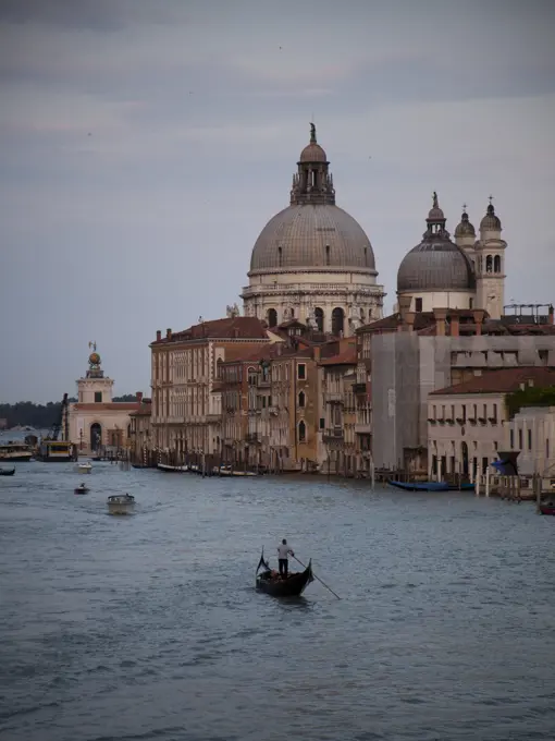 Italy, Venice, Lonely gondolier in gondola on canal