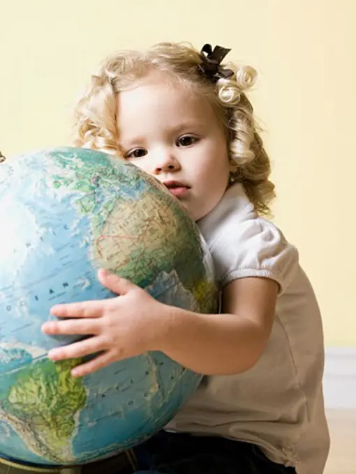 little girl with globe