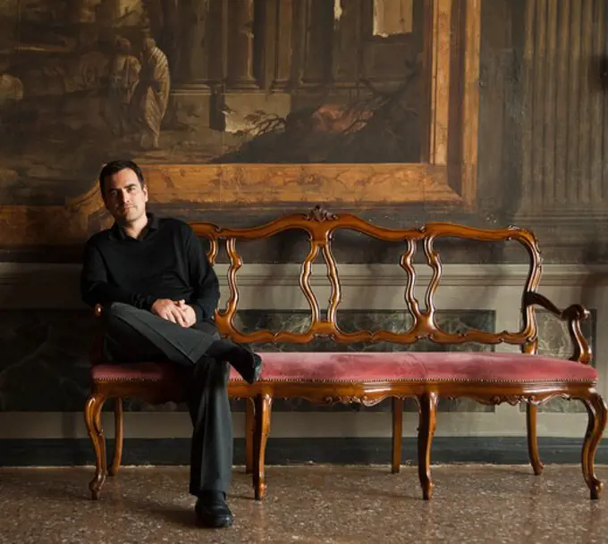 Italy, Venice, Mature man posing in museum hall