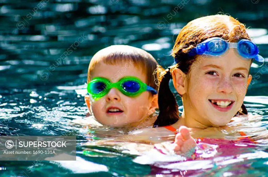 Sister and her brother in a swimming pool