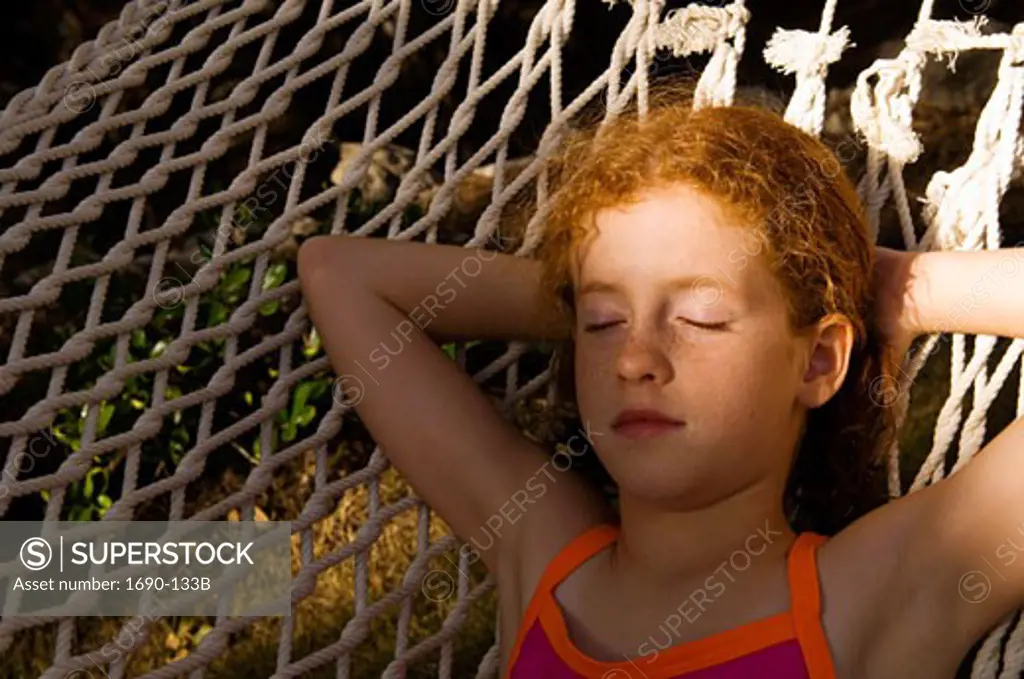 Girl sleeping in a hammock