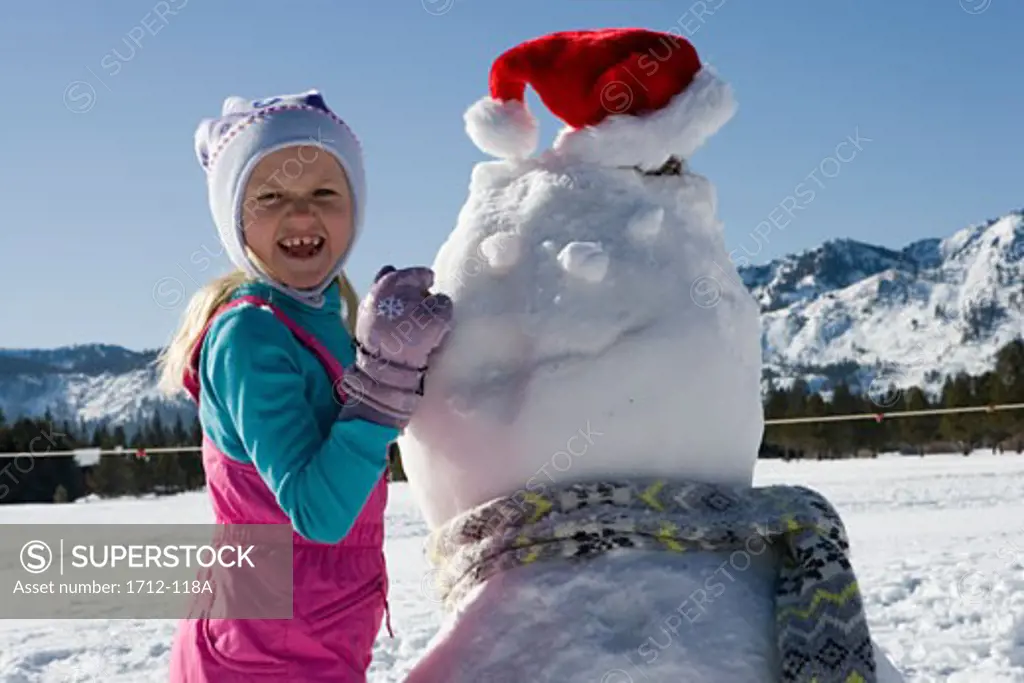 Girl building a snowman