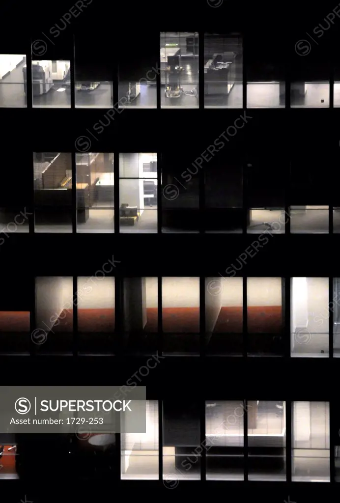 Office building showing an empty office for rent as a symbol of economic troubles at night, New York City, New York State, USA