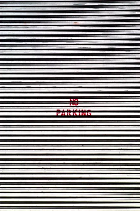 No parking sign on garage door, New York City, New York State, USA