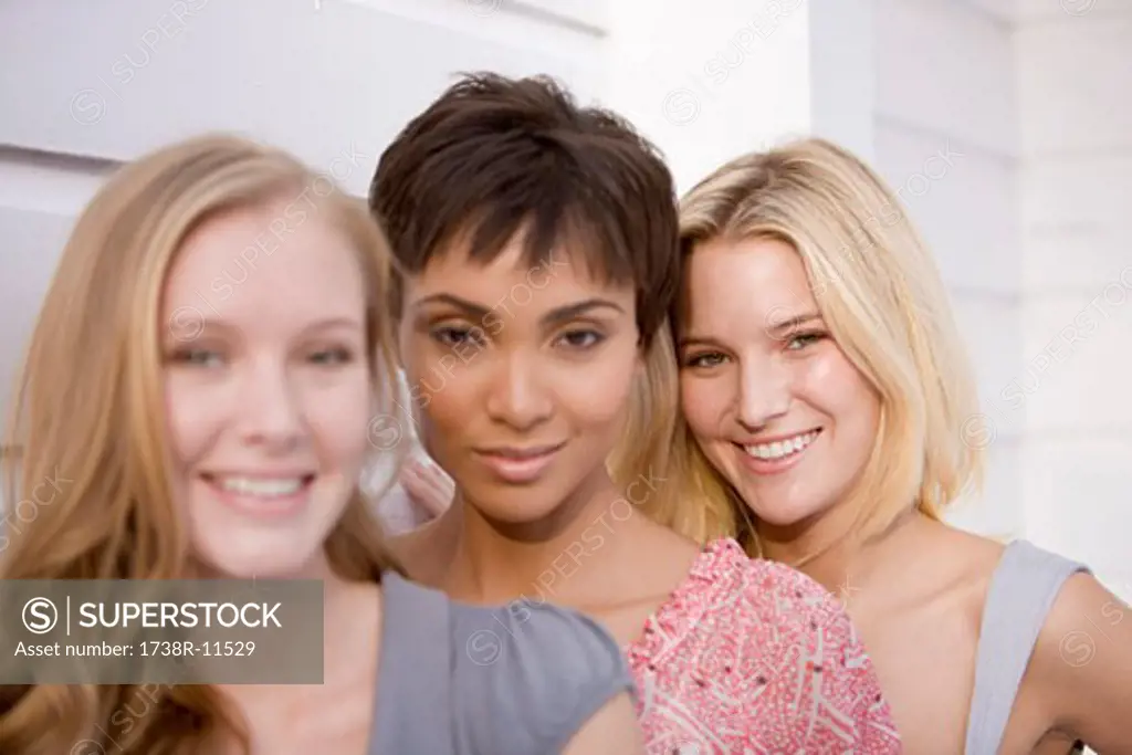 Portrait of three women smiling