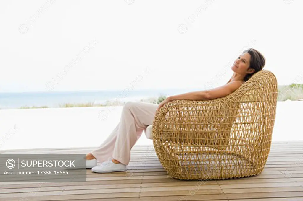 Woman reclining on a chair on the beach