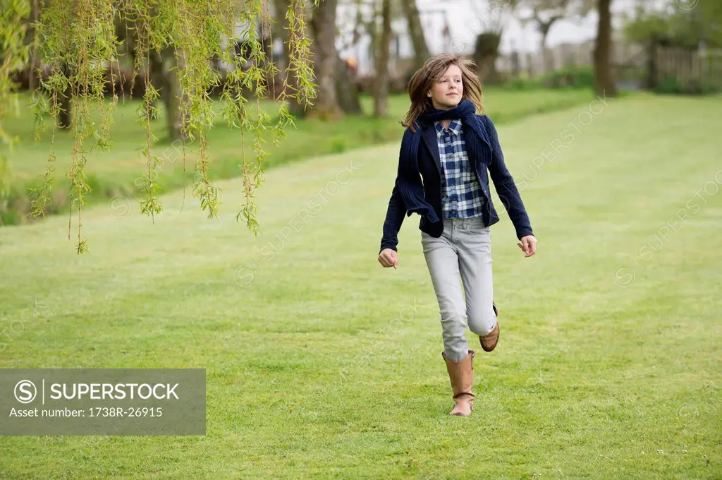 Girl running in a field