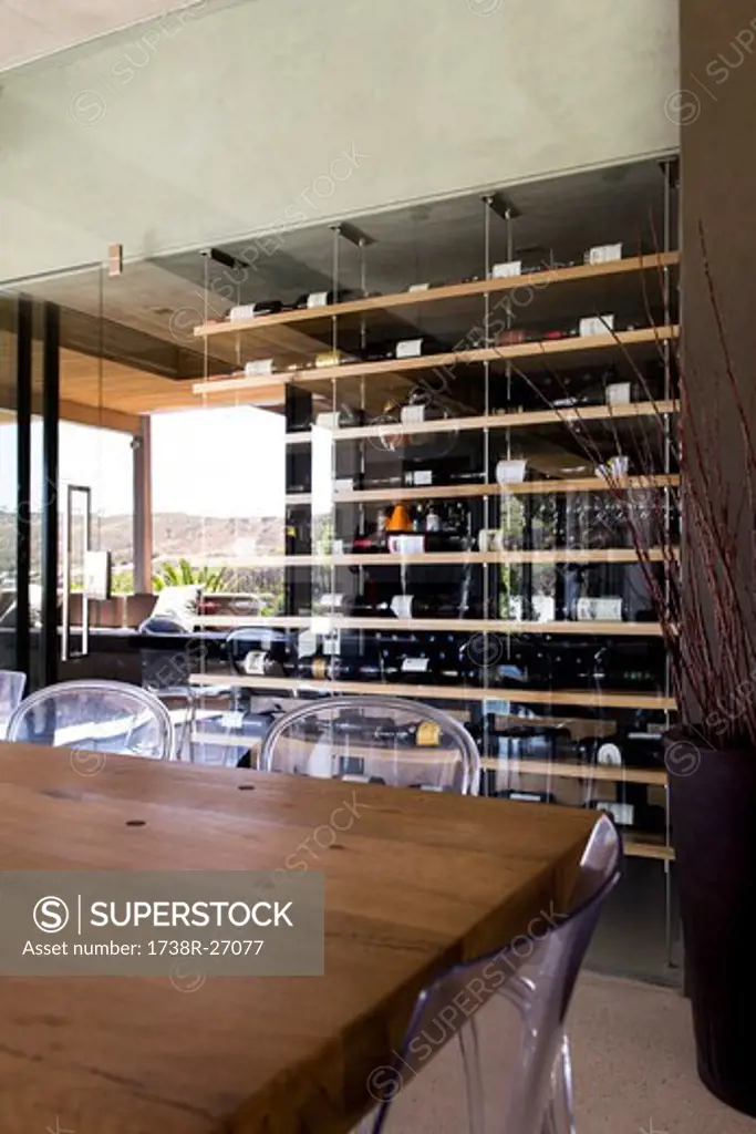 Interiors of a room with wine rack in the background