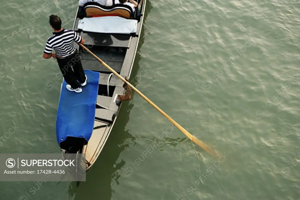 Man standing on boat, elevated view