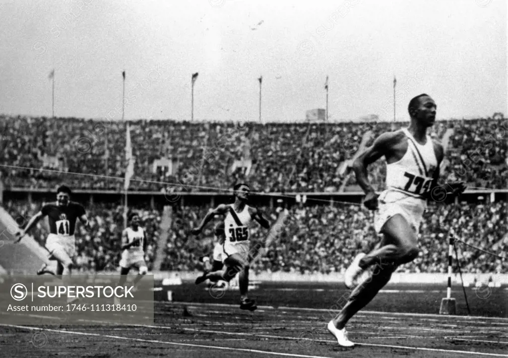 Jesse Owens running at the 1936 Olympics in Berlin.