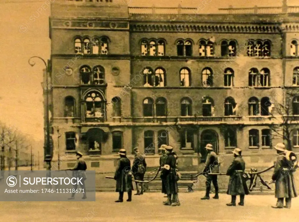 Police on guard at a barricade in Berlin. General civil strife in Berlin arose as the anarchy following the collapse of the Imperial Government in 1918.