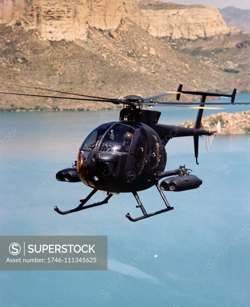 Photograph taken of a MD 530 MG Defender with two missiles. MD Helicopters, Inc. is an American aerospace manufacturer that produces helicopters for primarily commercial use. Dated 20th Century