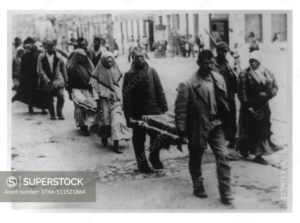 Two small coffins being carried on stretchers to a cemetery in the Volga famine district of Bolshevist Russia. The Russian famine of 1921, also known as the Povolzhye famine was a severe famine that killed an estimated 6 million and affected mostly the Volga and Ural River region.