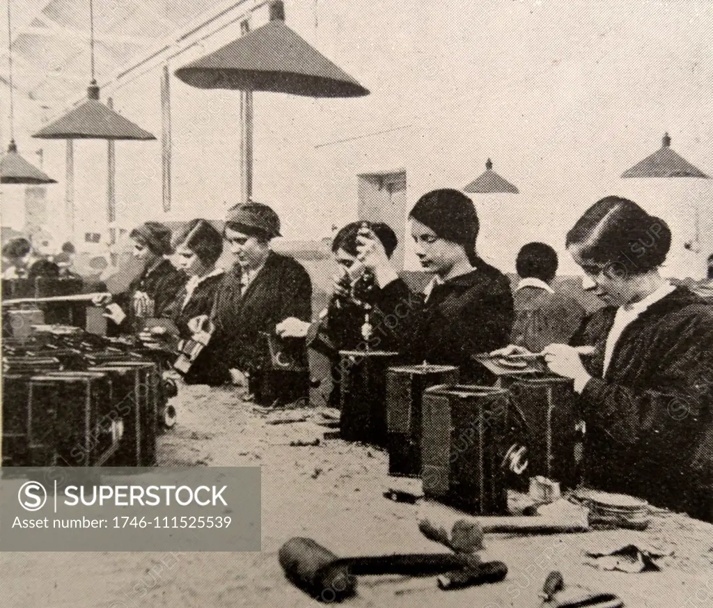 Women doing war work. Assembling naval signal lamps; England during world war one 1916