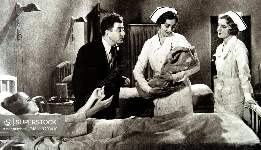 Life Begins', 1932. Nurse Aline MacMahon gives her baby to Gloria Shea while the father, Frank McHugh looks on. This film which took place entirely in a maternity ward, was typical of many hospital pictures of the early thirties.