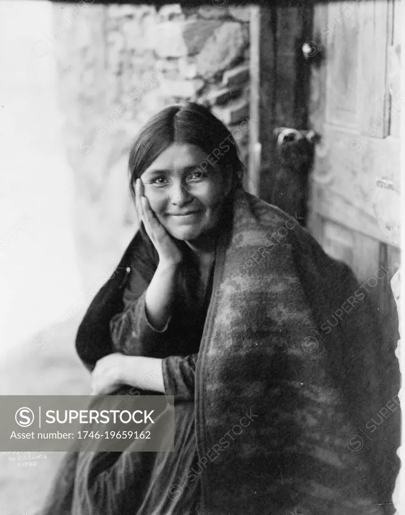 Smiling Native North American Indian woman. Photograph by Edward Curtis (1868-1952).