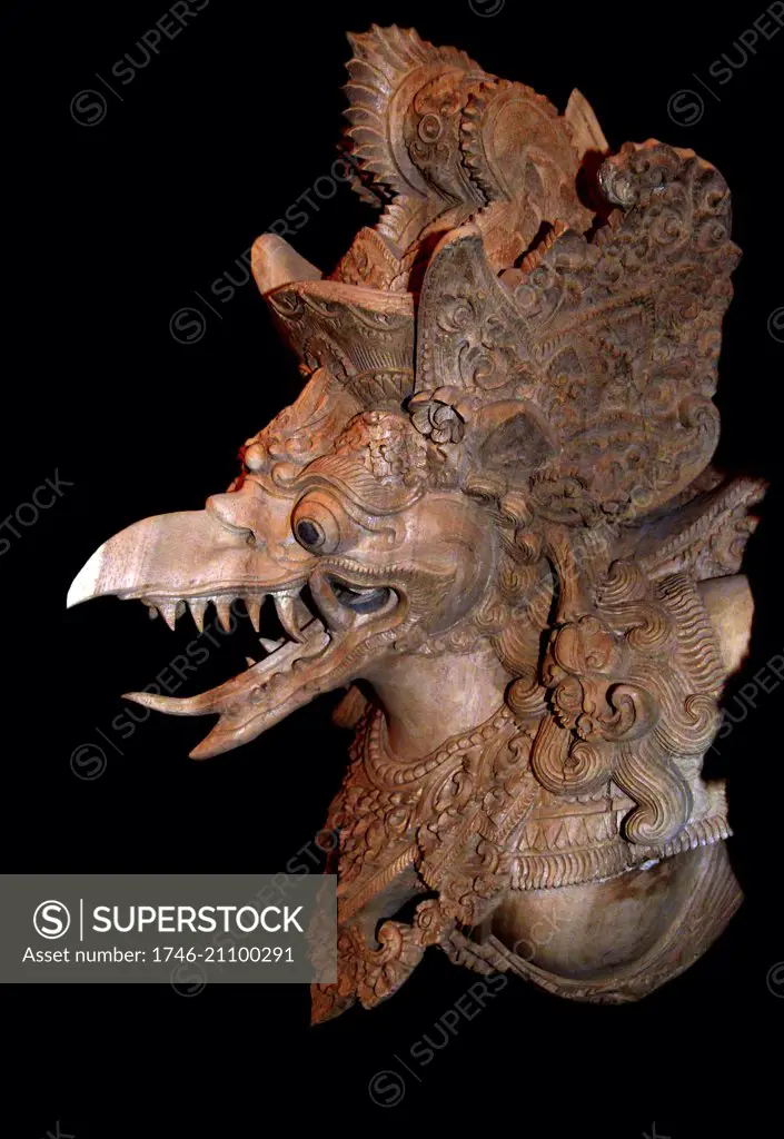 detail of a wooden carved statue of an Indonesian garuda. The Garuda is a large mythical bird; bird-like creature; or humanoid bird that appears in both Hindu and Buddhist mythology. Garuda is the mount (vahana) of the Lord Vishnu. Garuda is the Hindu name for the constellation Aquila. The Brahminy kite and Phoenix are considered to be the contemporary representations of Garuda