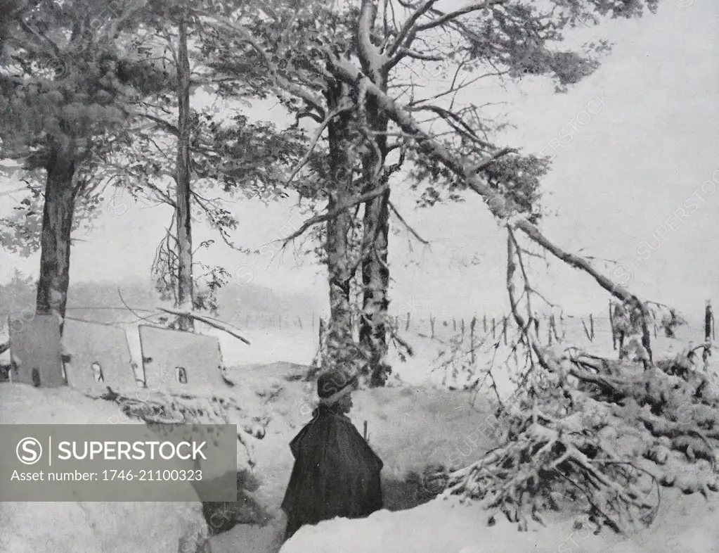 Photograph of a French Soldier in a snow filled trench during World War One. Dated 1916