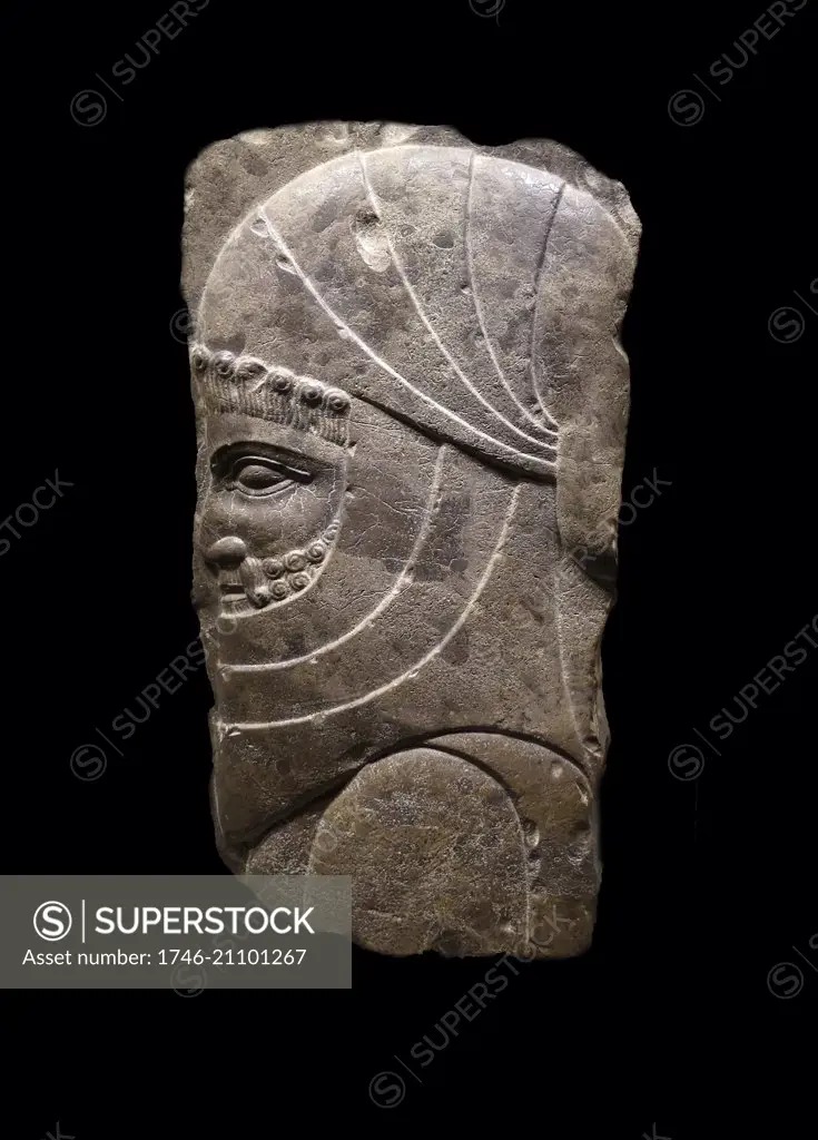 Stone relief fragment depicting a Persian priest or holy servant. Dated 4th Century BC