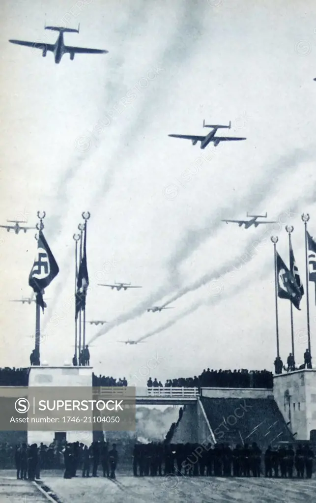 Photograph of fighter planes flying over a Nazi Rally. Dated 1941