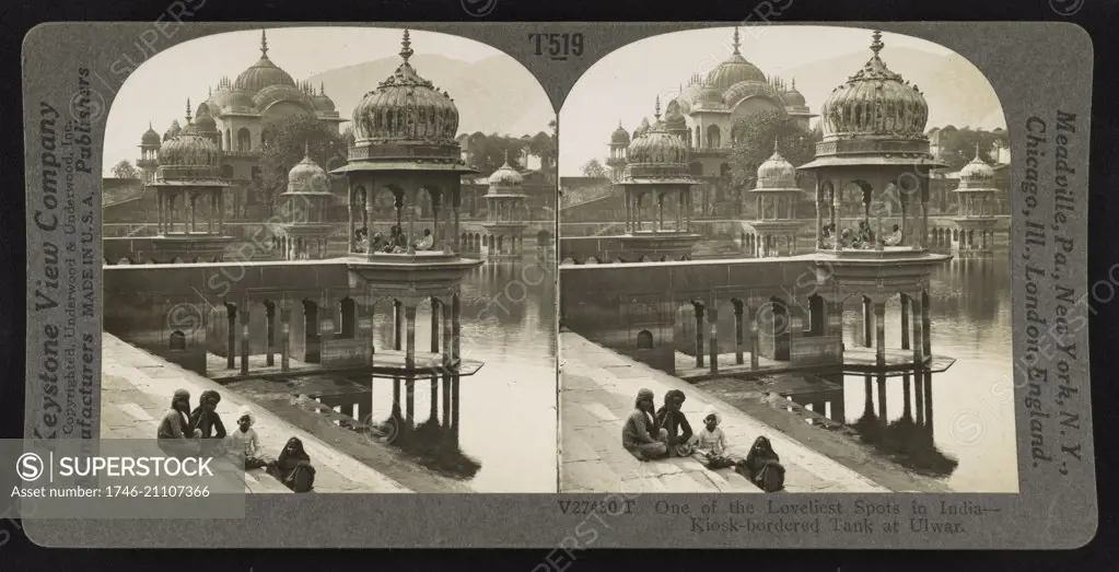 Photographic print of domed kiosks and a large cenotaph around a man-made pond, with steps leading to the waters edge from walkways and plazas, in Alwar, India. Dated 1930