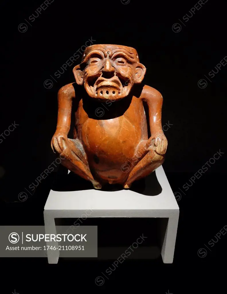 Mayan ceramic anthropomorphic pot, depicting an old man seated with his hands upon his knees. 600-900 AD Xcambo, Yucatan, Mexico