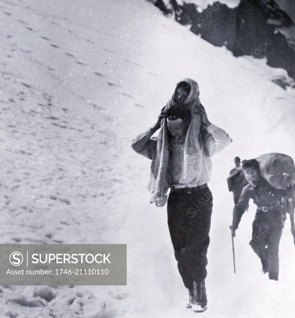 Refugees cross snow covered mountains to escape from Spain to Luchon, France, across the Pyrenees, during the Spanish Civil War