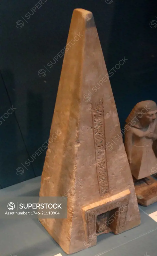 Small limestone pyramid of Buqentef. 19th Dynasty, about 1295-1186 BC From Thebes, Egypt. The figure in the niche represents the deceased. The inscriptions contain prayers for offerings, addressed to the gods Re-Horakhty-Atum, Anubis and Osiris.