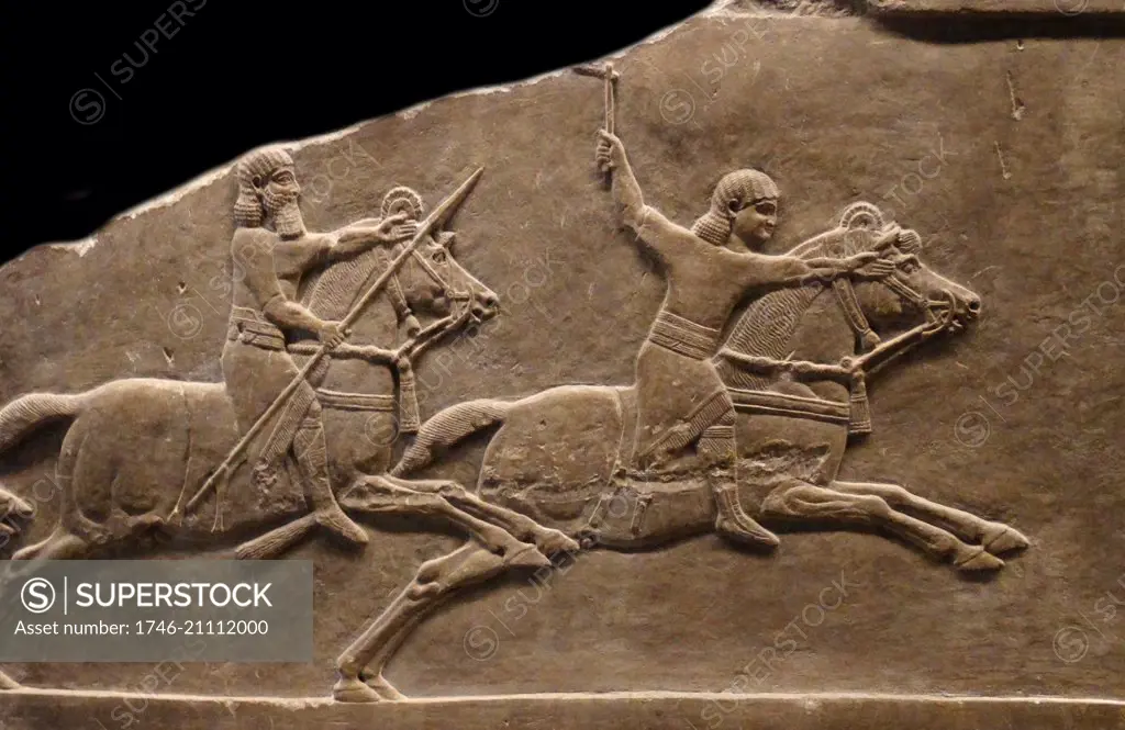 Hunting gazelle. Assyrian, about 645-635 BC From Nineveh, North Palace. A herd of gazelle, grazing peacefully, is disturbed by a huntsman waving a whip on the right. One of them looks round,